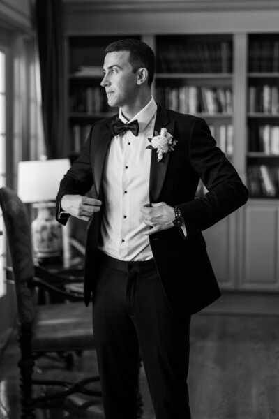 Groom getting ready at River House Events in St. Augustine, Florida—timeless wedding preparation in a waterfront venue, captured by Watters & Co. Events.