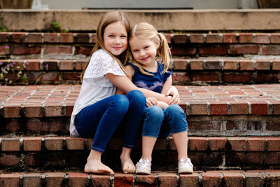 sisters embracing during family photography session