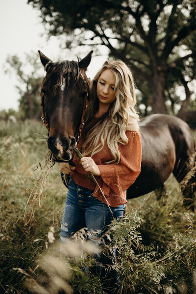 Kaylee poses with a horse