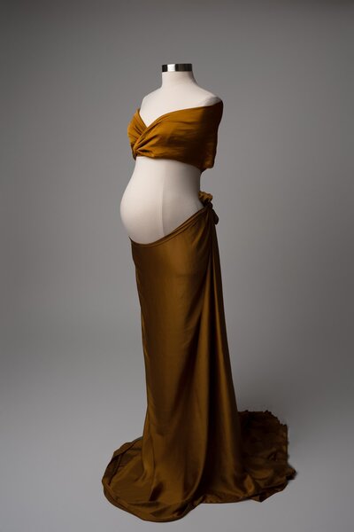 Caramel two-piece maternity fabric styled with one-shoulder wrap