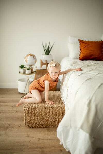 little girl playing in bedroom