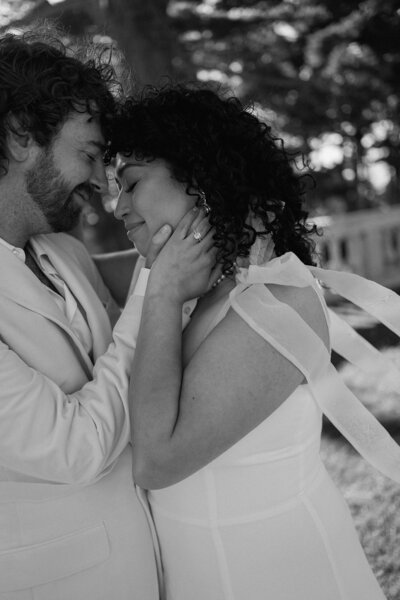 a bride & groom going in for a kiss