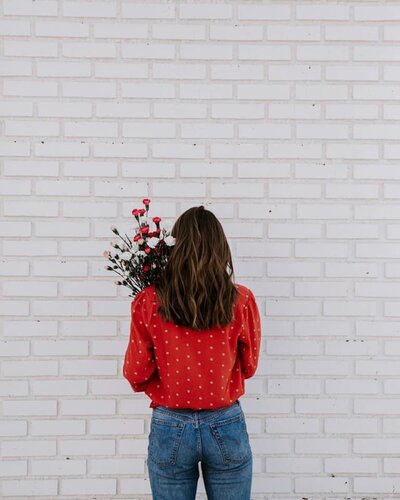 Woman posing with flowers