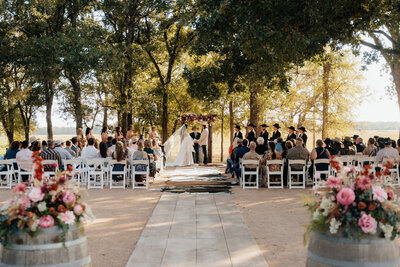 bride and groom standing at alter