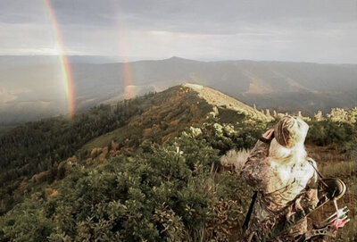 Brittney-Long-Bow-Hunting-Looking-Out-At-Mountain-Rainbow