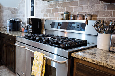 Five burner gas stove in updated Oklahoma kitchen