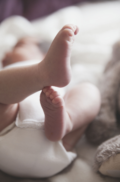 An adorable and incredible close-up of a baby's foot, showcasing the tender moments at a Texas postnatal retreat.