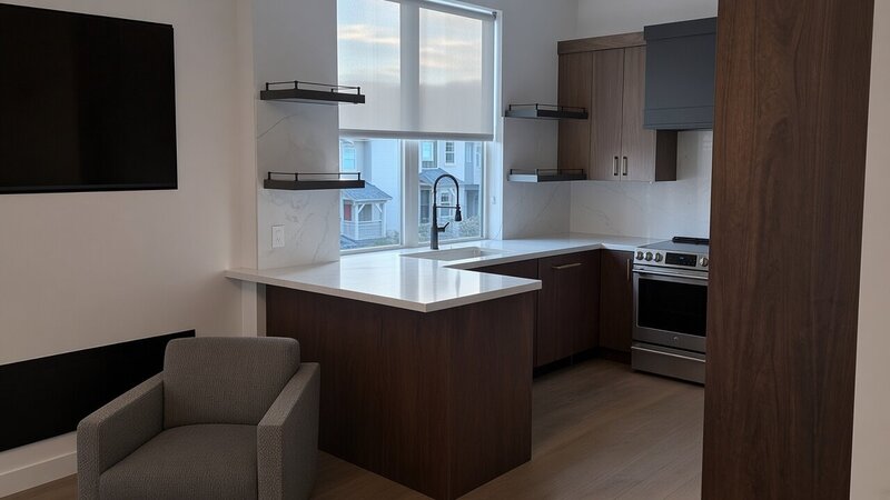 Roller shade over the kitchen window of a Park City, Utah live/work space