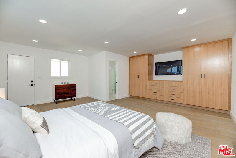 Bedroom with custom built-in cabinetry