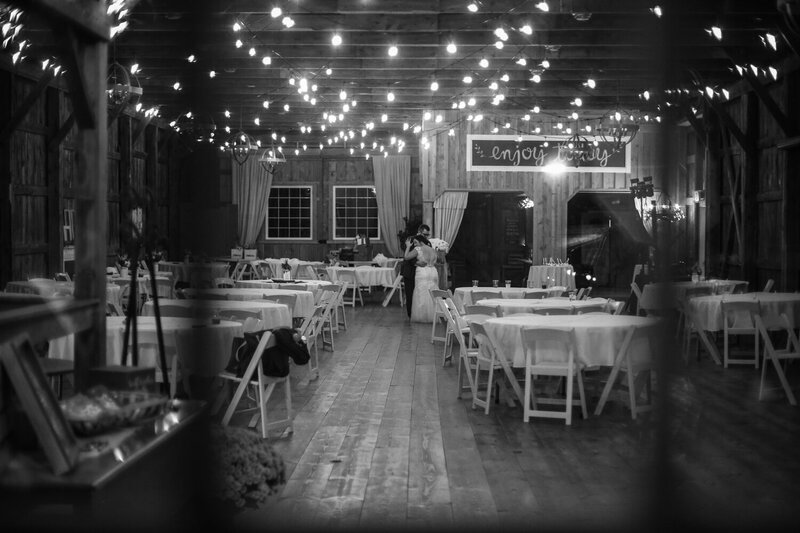 Photo of bride and groom dancing alone at the end  of a Port Farms wedding reception