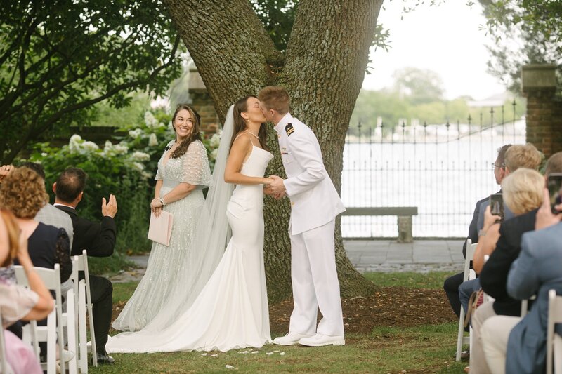 Bride and groom kissing at their wedding ceremony