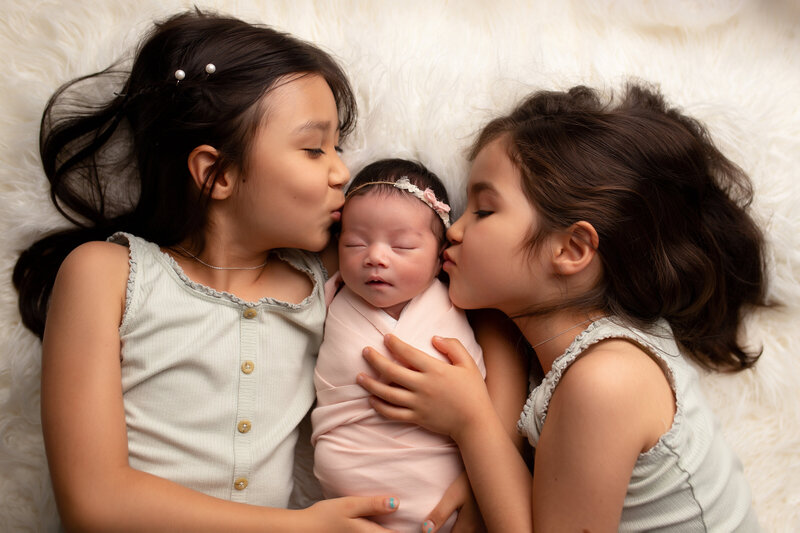 Big sister with baby sister in santa clarita photography studio