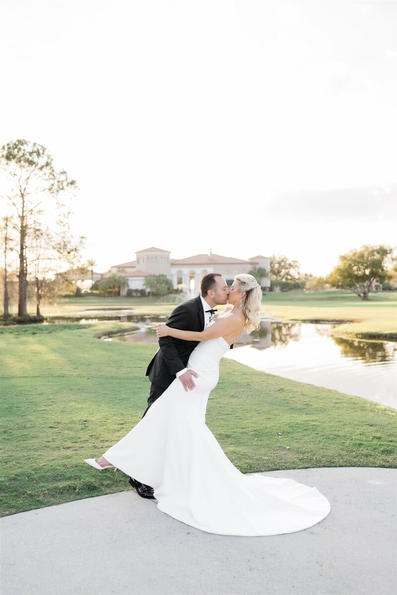 Bride and Groom Portrait on a golf course at the Country Club of Orlando by Orlando wedding photographer