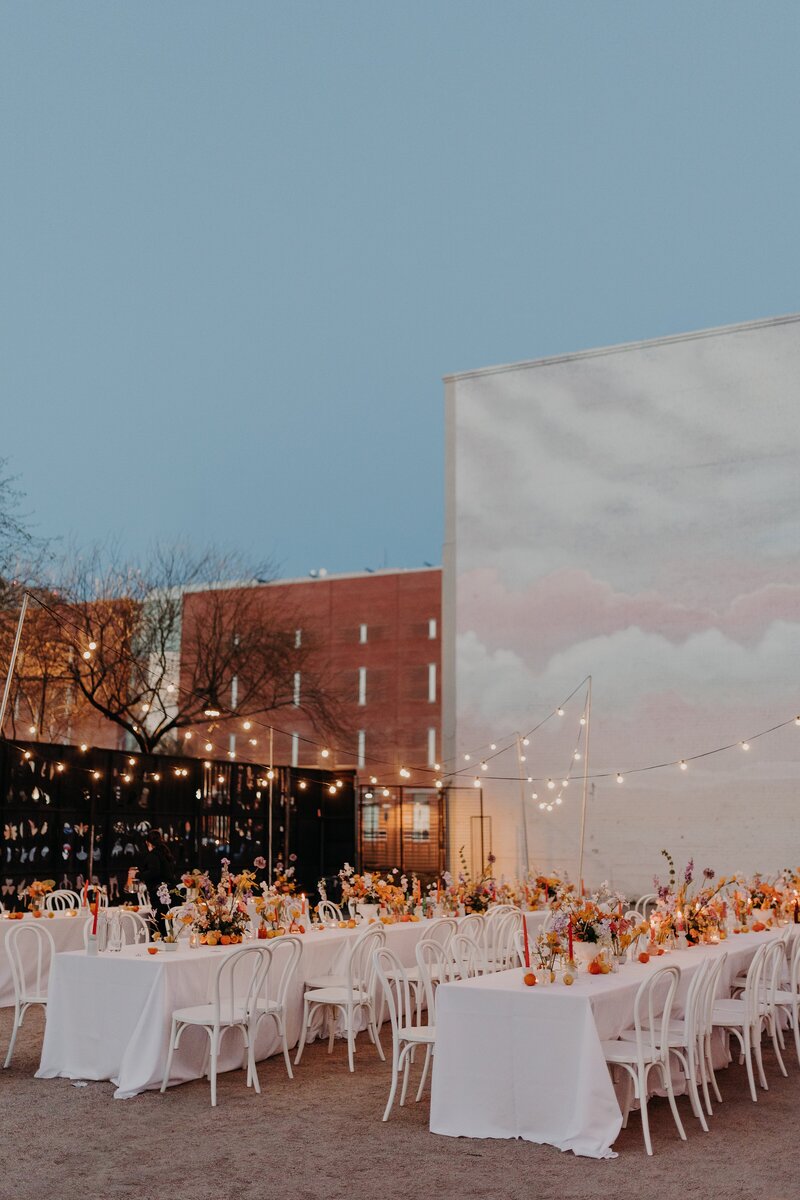Outdoor wedding reception tables with twinkle lights