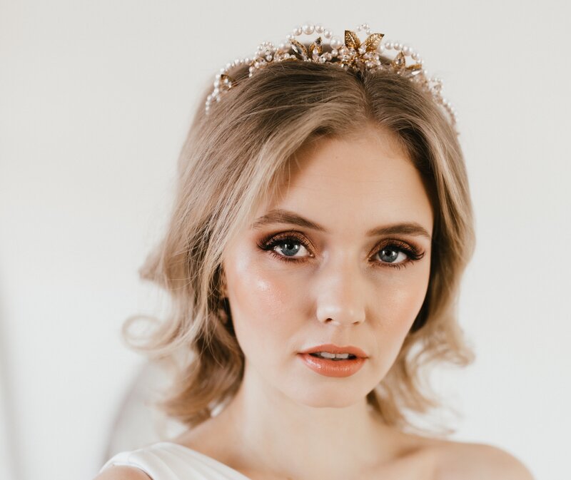 Shimmering peach elegant modern bridal makeup