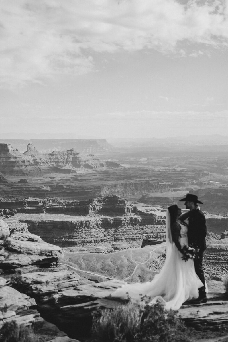 cowboy-groom-with-bride-canyon-view
