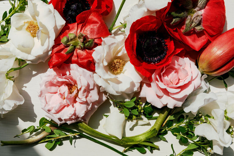 Red poppies, garden roses, and peonies