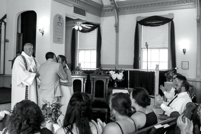 Bride and Groom kissing in wedding ceremony | Wedding Photography