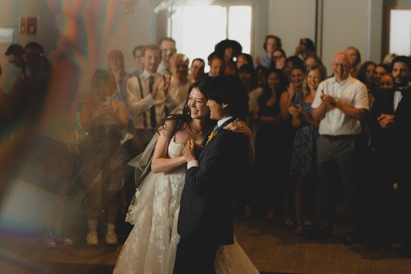 Wedding couple doing their first dance in front of their guests