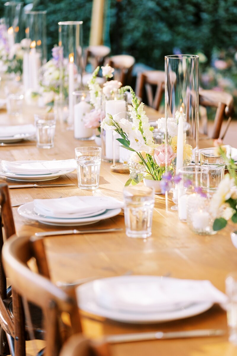 Beautiful wedding tablescape with candles and florals