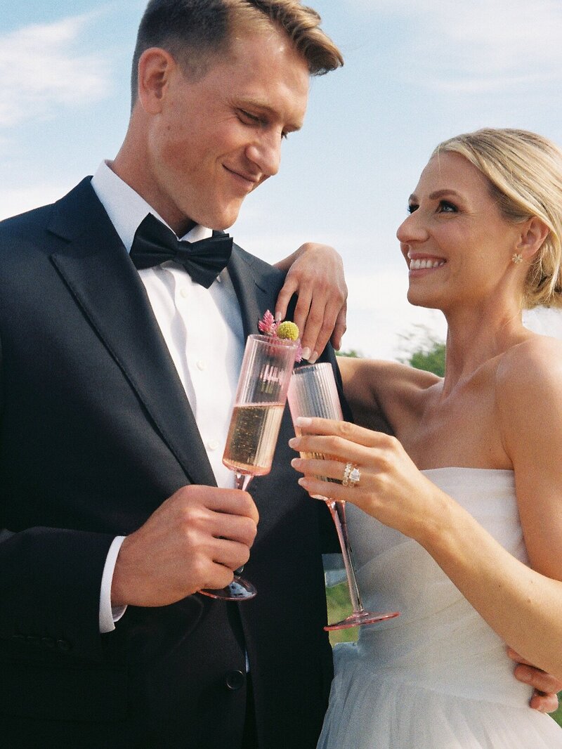 Vermont Wedding Photographer | Sincerely Liz Photography Documentary Wedding, Engagement, Elopement, Maternity and Newborn Photographer in New England | Bride and groom smiling at each other as they toast with champagne