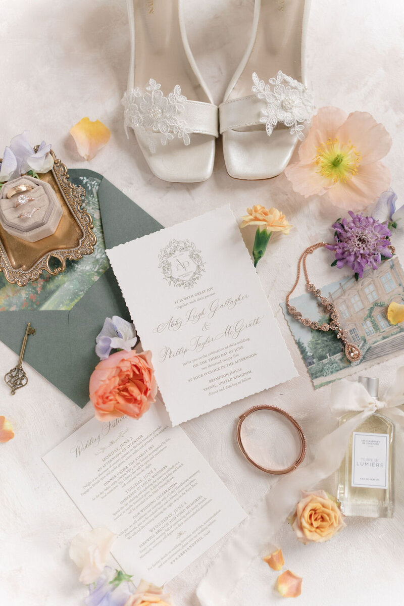 Custom floral wedding invitations with rink box and floral decor