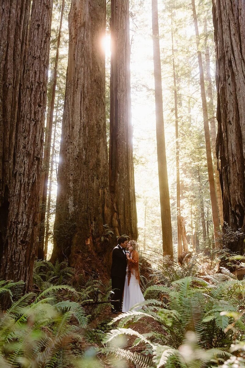 LGBTQ couple running holding hands during their California elopement at Anza-Borrego State Park, California.