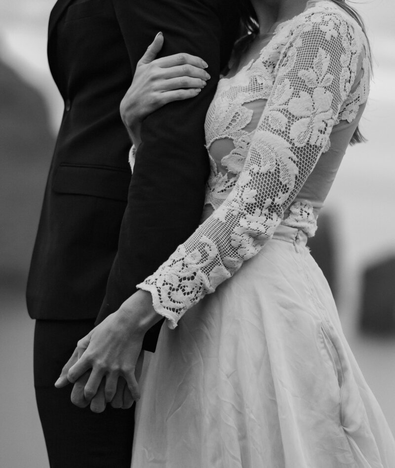 Faroe Islands elopement portraits – bride and groom laughing in the wind, by Kollar Photography.