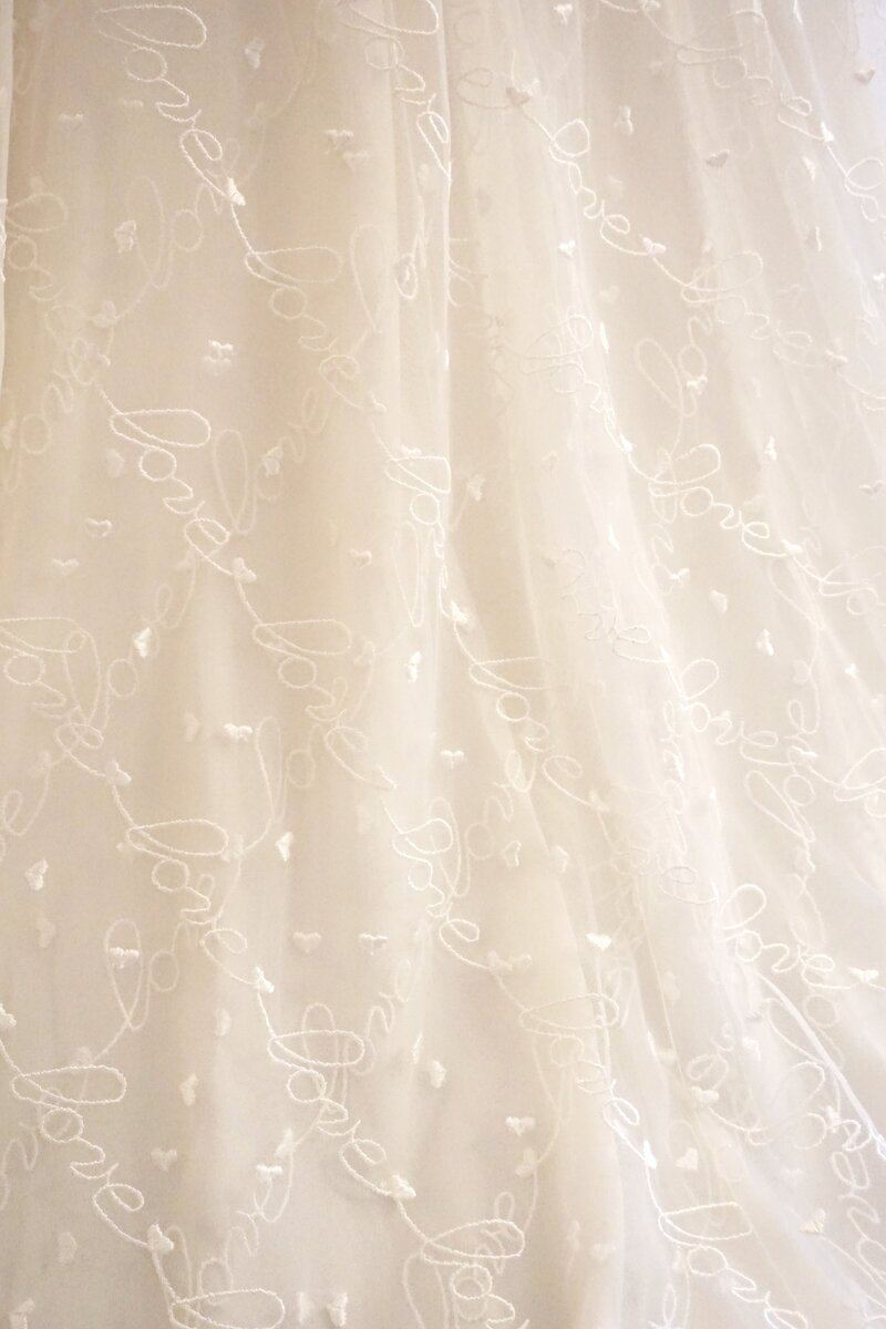 Lace and tulle wedding dress with delicate details