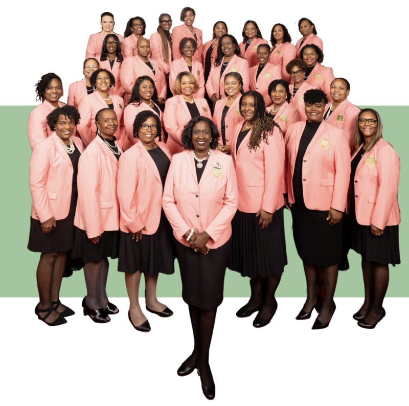 Phi Alpha Omega Chapter members wearing pink blazers standing in a group of 38