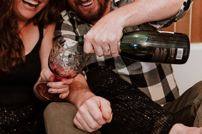 Couple partying in a bathtub with champagne and a disco ball in Breckenridge, Colorado.