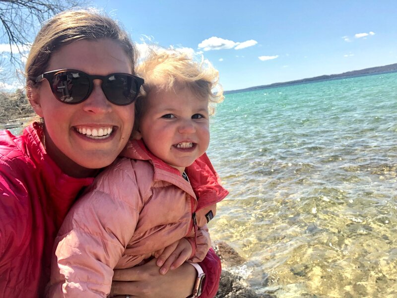 Alison and her daughter smiling for camera