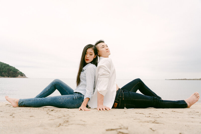 A cinematic black-and-white engagement session photographed on the shores of Jeju Island, Korea by Top luxury destination photographer Michael Asmussen. Styled with timeless Korean-American minimalism, this editorial captures the modern couple in a soulful coastal narrative—designed for high-end wedding clients seeking artful storytelling and refined vision.