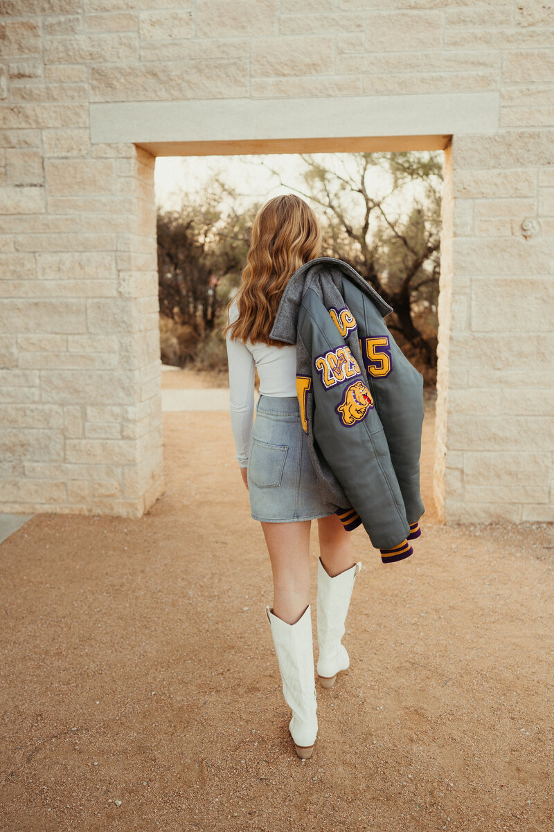 Couple rolls in the bed laughing at each other. 