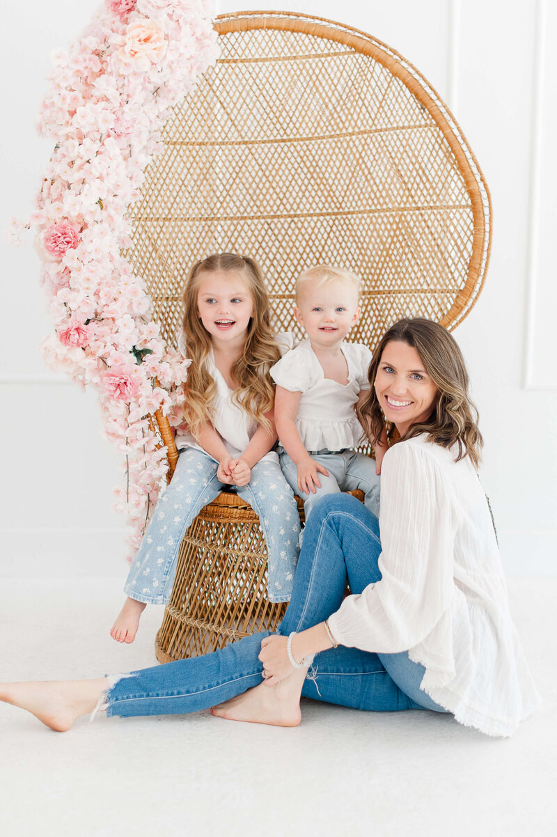 Photo of an award winning Cocoa Beach Family Photographer with her daughters in the studio.