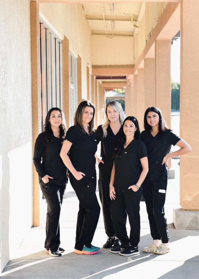 group of ladies in black scrubs