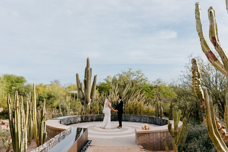 Arizona eloping couple hugging with the sunset behind them
