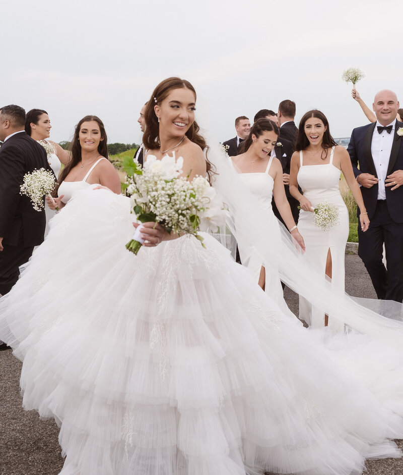 wedding party walking shot with the bride