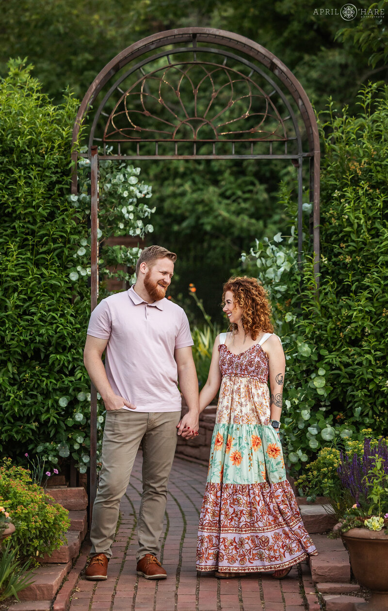 Beautiful photo in front of an iron gate at  Denver Botanic Gardens Welcome Garden