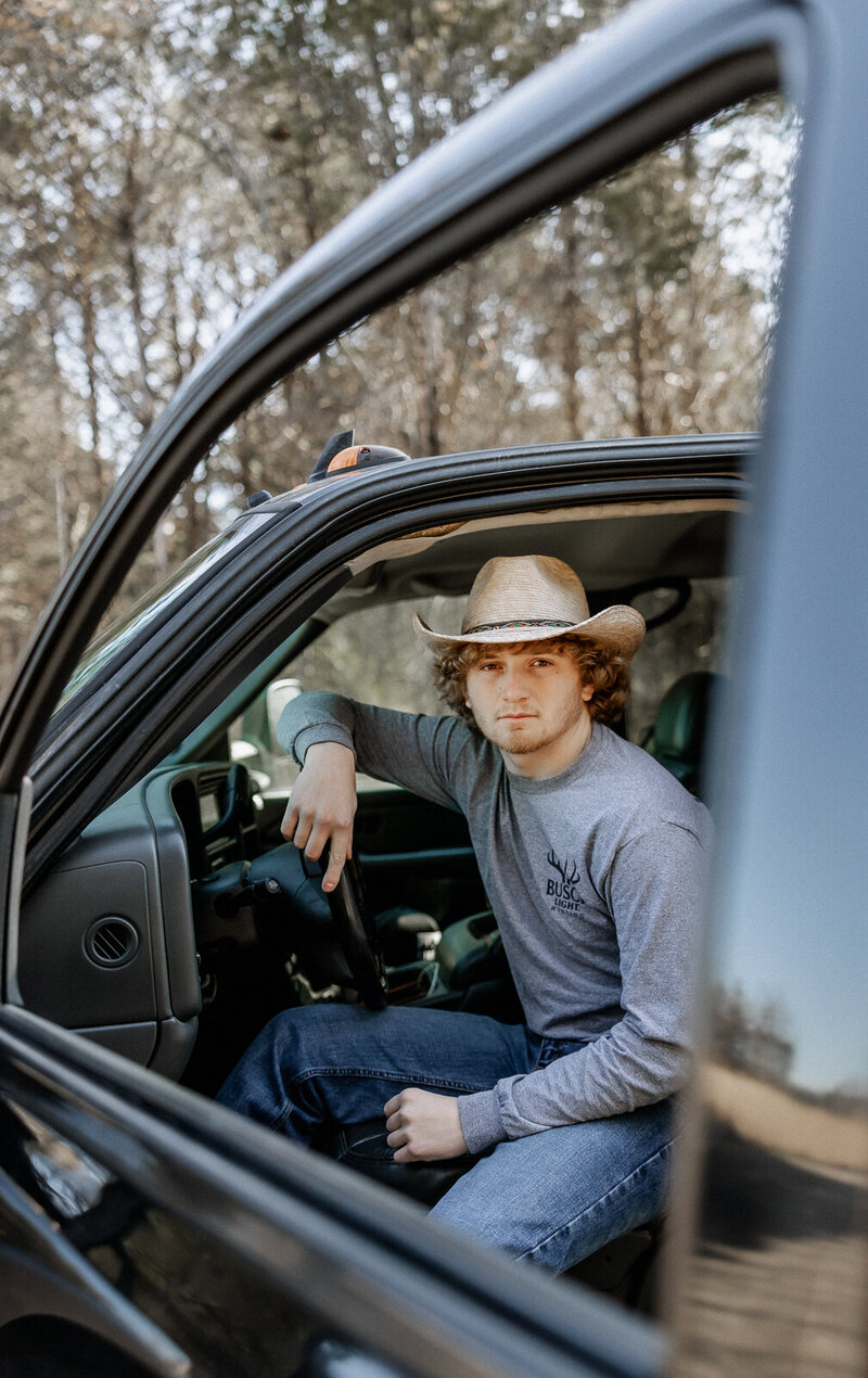 Senior guy sitting in his truck in Farmington, Missouri. 