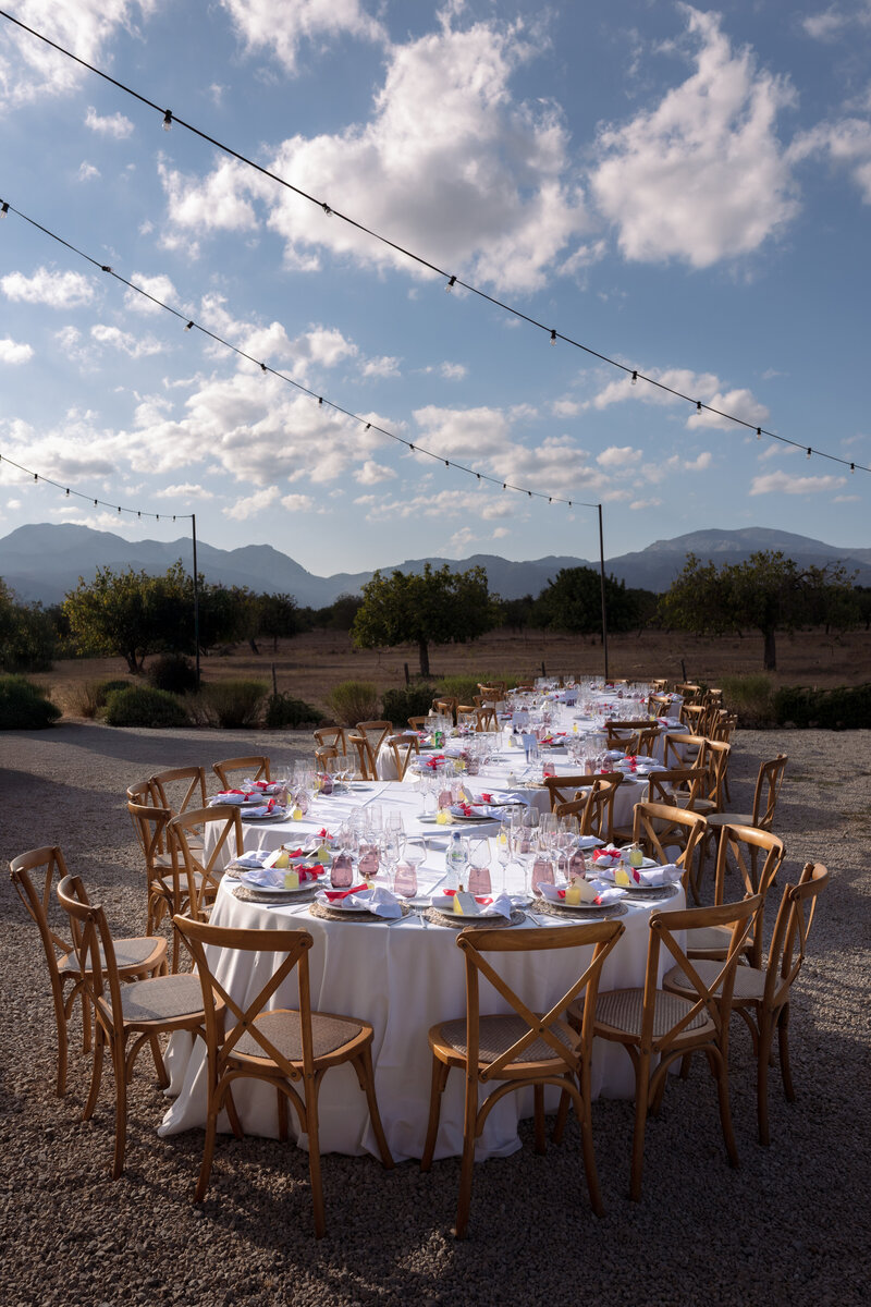 Wedding photographer captures couple taking a stroll hand in hand at their french chateau wedding.