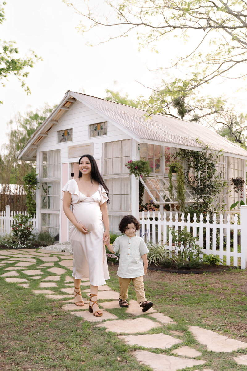 Mother and son pose for a San Antonio Family Photoshoot at the Valerie Marie Greenhouse.