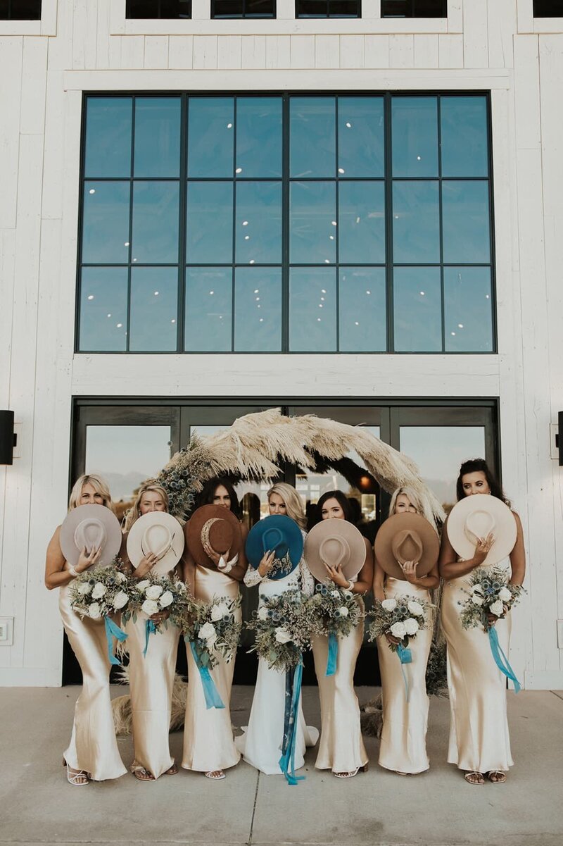 bridal party holding hats