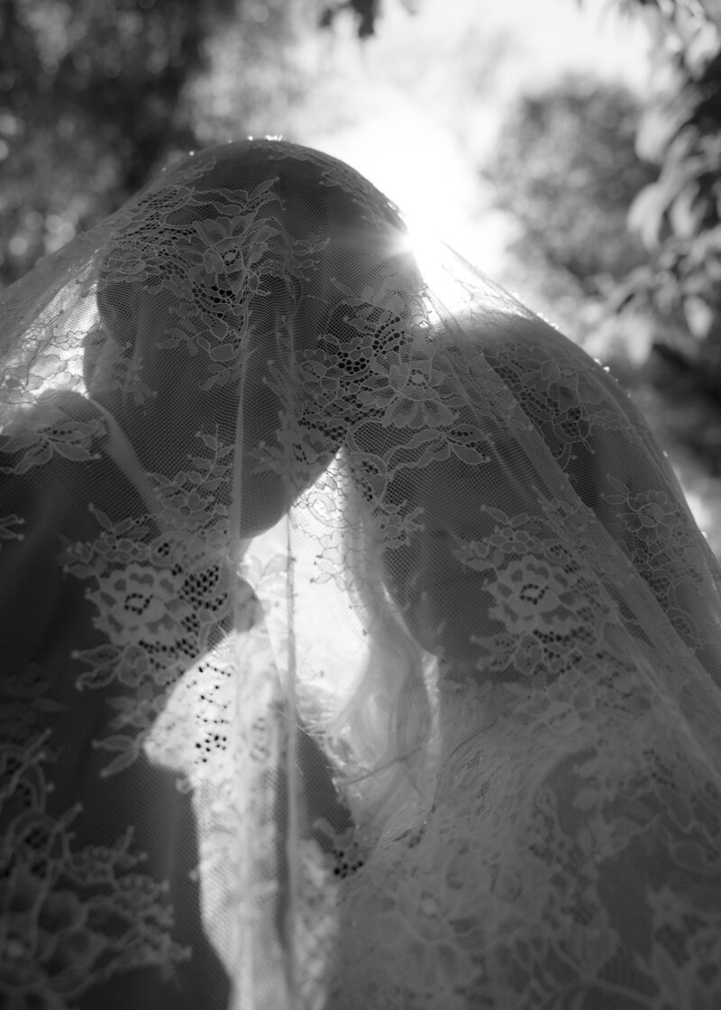 The bride and groom wanted a photo of the two of them underneath her lace veil creating a unique and dreamy photograph they will love forever.