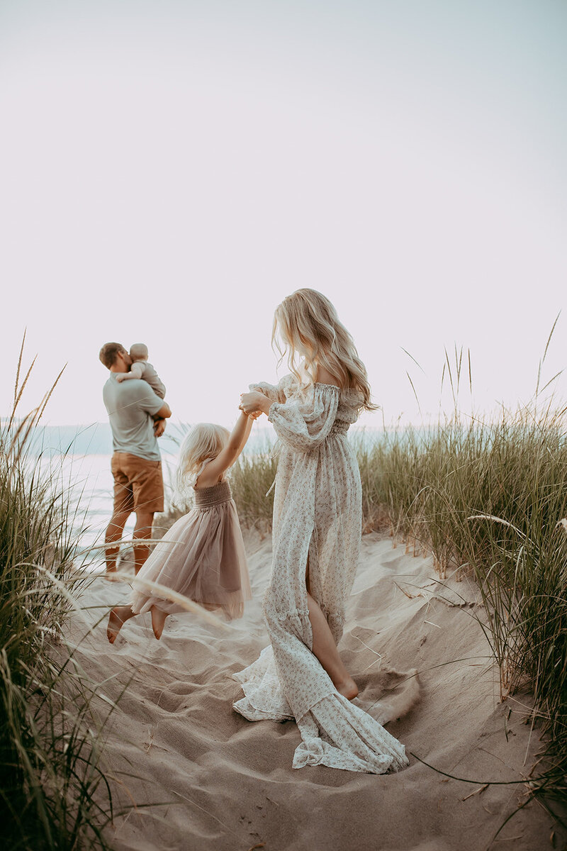 Family enjoying the beach during their photoshoot in Waterloo, Ontario.