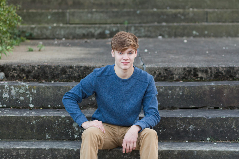 high school senior guy sitting on old stone steps at the OARDC in Wooster Ohio, photographed by Jamie Lynette Photography, Canton ohio senior photographer
