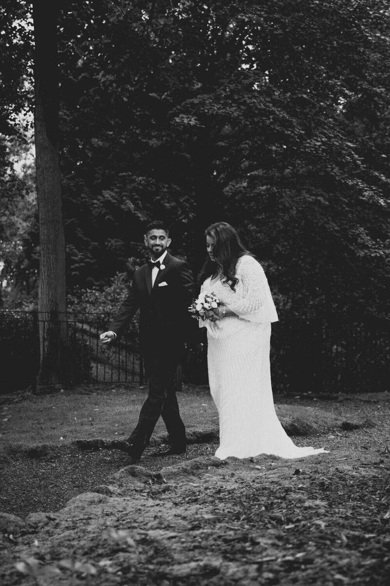 Bride & Groom walk in gardens