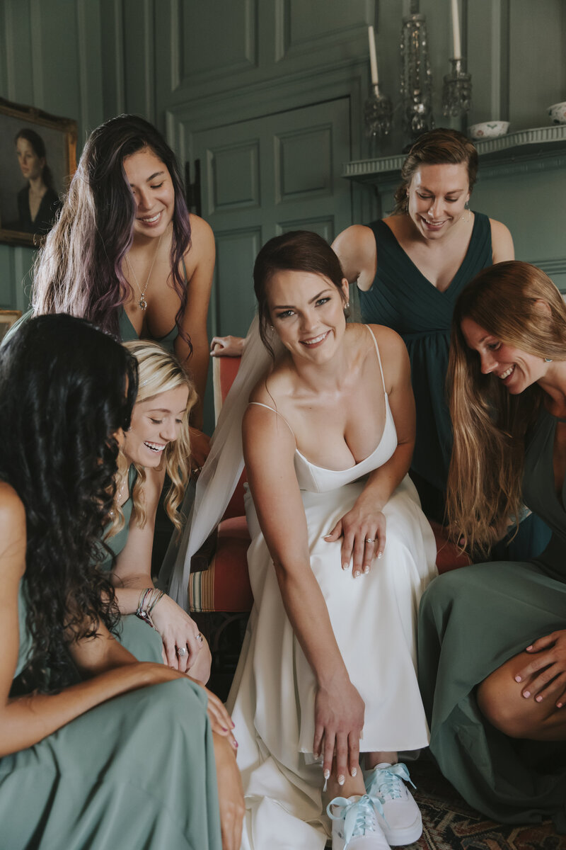 A bride with her bridal party getting ready by Richmond wedding photographer, Kat Jones Creative