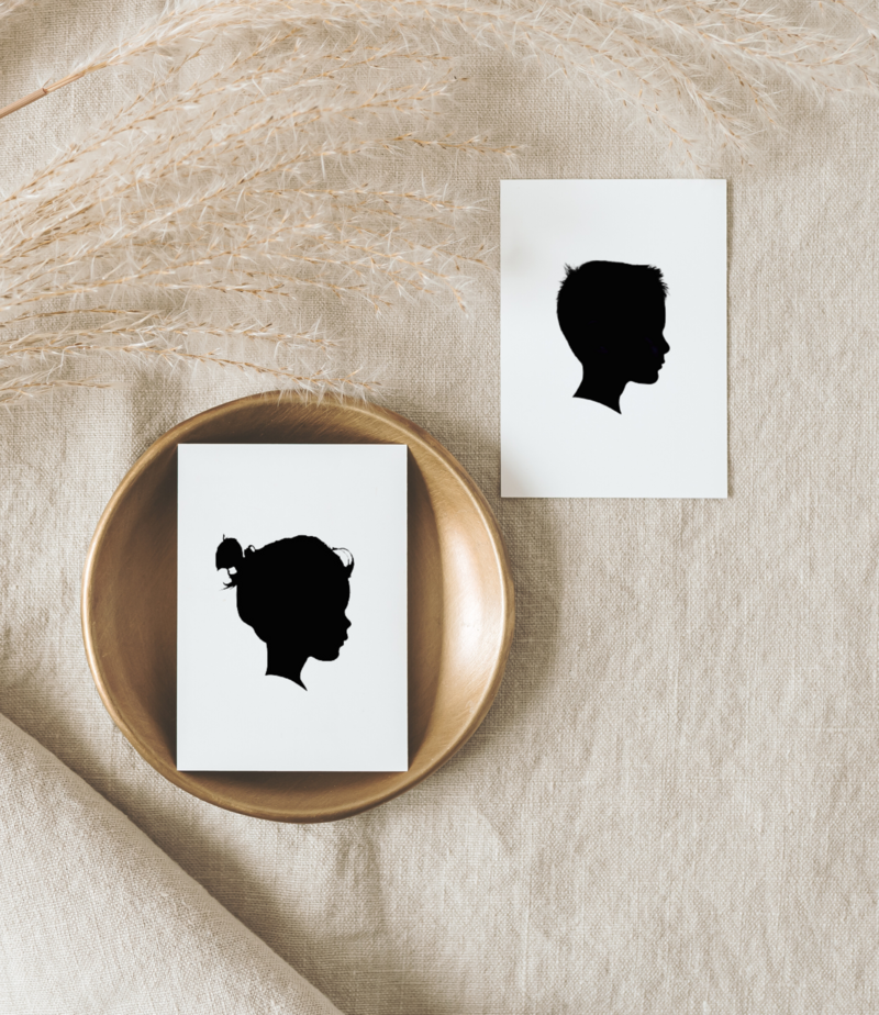 flat lay photo of child silhouette portraits