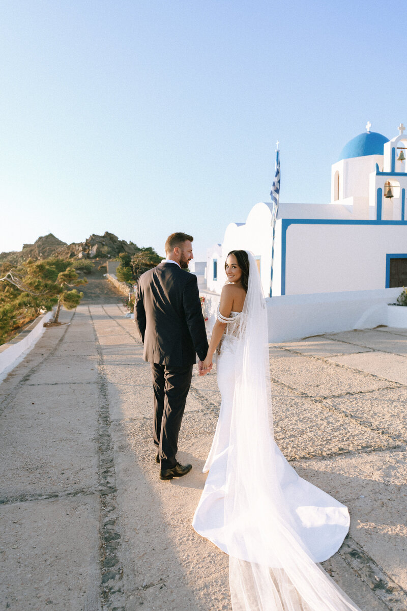 Bride and groom sharing a romantic moment in a mountain meadow during their intimate Grand Teton wedding, photographed by Seattle destination wedding photographer Rachael Marie Photography